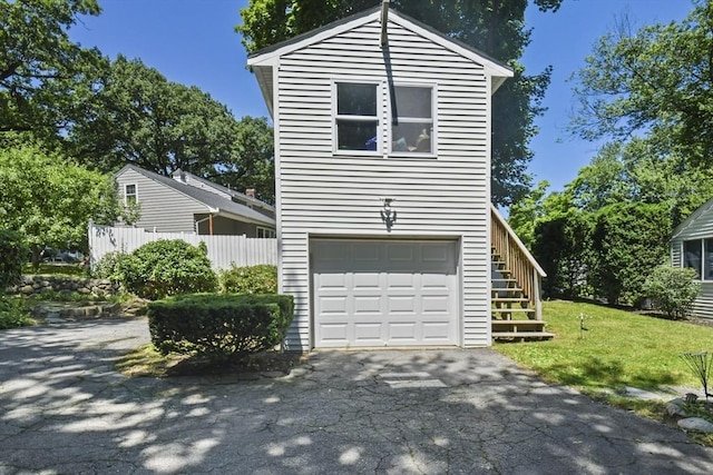 369 Vernon St, Wakefield, MA 01880 - view of front of house with stairs, driveway, and a garage