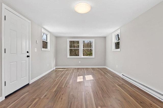 369 Vernon St, Wakefield, MA 01880 - entrance foyer with baseboard heating and wood finished floors