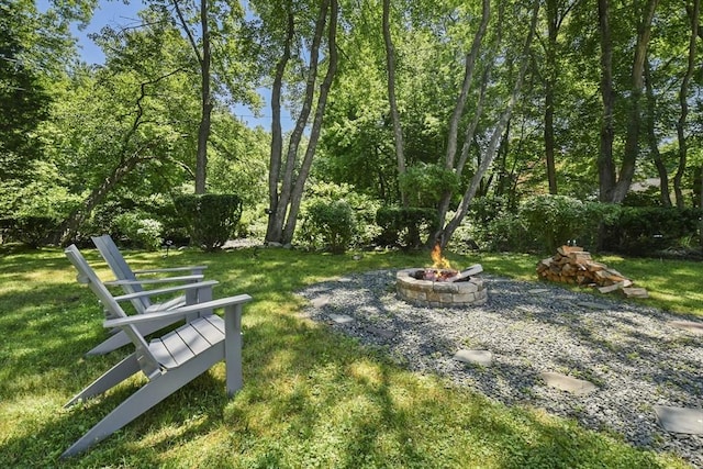 369 Vernon St, Wakefield, MA 01880 - view of grassy yard featuring an outdoor fire pit