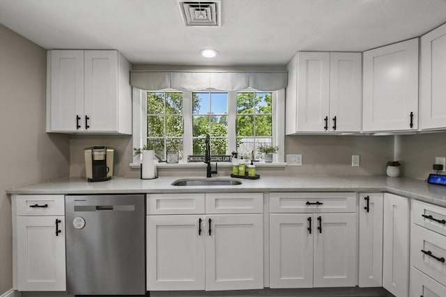 369 Vernon St, Wakefield, MA 01880 - kitchen with dishwasher, white cabinets, and light countertops