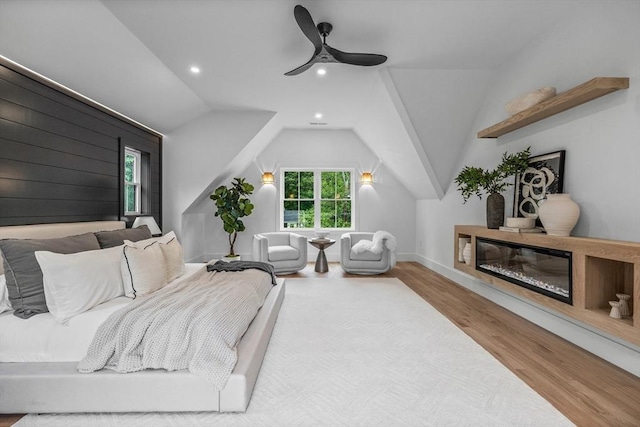 1 Maud Graham Cir, Burlington, MA 01803 - bedroom with wood finished floors, recessed lighting, a glass covered fireplace, lofted ceiling, and ceiling fan
