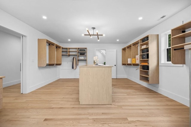1 Maud Graham Cir, Burlington, MA 01803 - kitchen featuring open shelves, a center island, light wood-style flooring, and recessed lighting