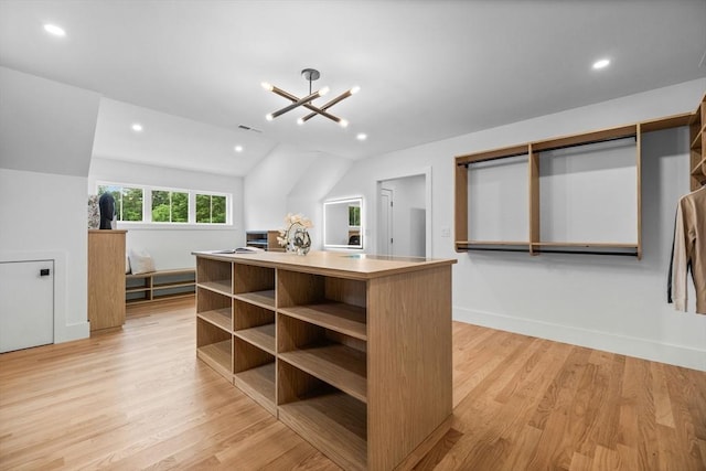 1 Maud Graham Cir, Burlington, MA 01803 - spacious closet with light wood finished floors, a chandelier, and vaulted ceiling