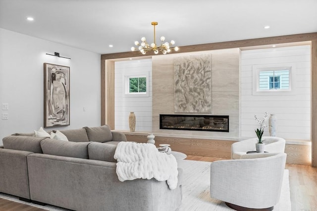 1 Maud Graham Cir, Burlington, MA 01803 - living room with wood finished floors, a high end fireplace, a chandelier, and recessed lighting