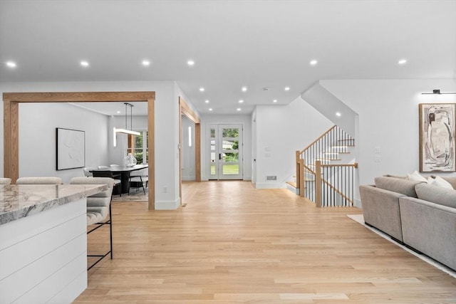 1 Maud Graham Cir, Burlington, MA 01803 - living area featuring light wood-type flooring, stairway, and recessed lighting