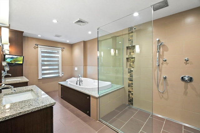 bathroom featuring vanity, separate shower and tub, and tile patterned floors