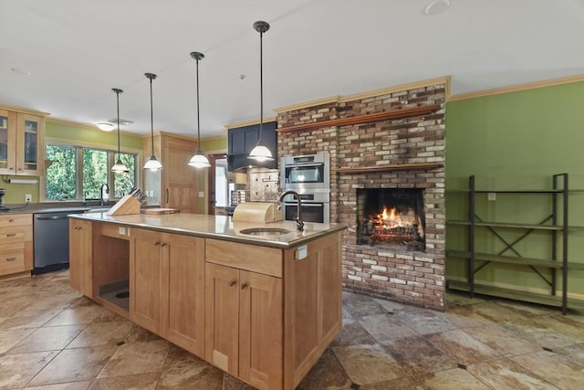 kitchen featuring a center island with sink, appliances with stainless steel finishes, ornamental molding, pendant lighting, and sink