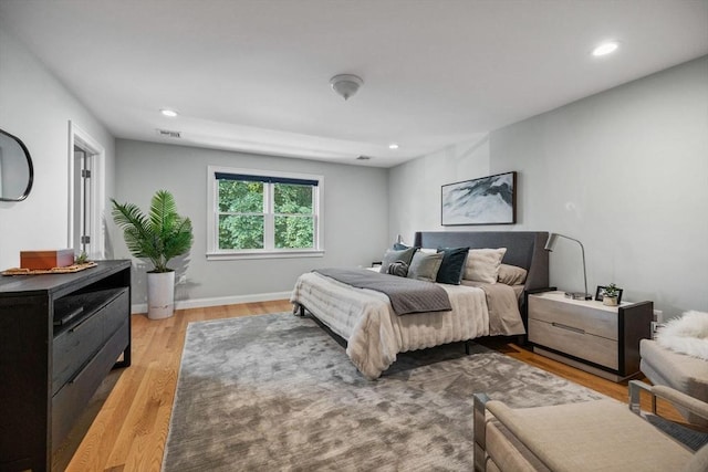 125 Ash St Unit 1, Waltham, MA 02453 - bedroom with light wood-style floors and recessed lighting
