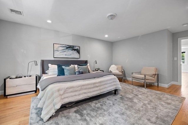 125 Ash St Unit 1, Waltham, MA 02453 - bedroom with light wood finished floors and recessed lighting