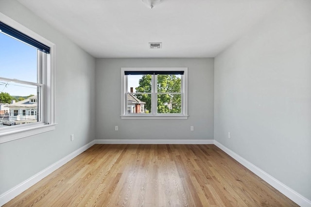 125 Ash St Unit 1, Waltham, MA 02453 - empty room with light wood-style floors and baseboards