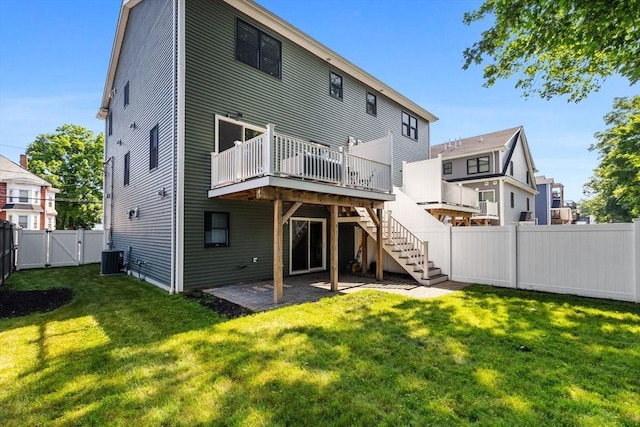 125 Ash St Unit 1, Waltham, MA 02453 - rear view of house with a gate, a deck, a fenced backyard, stairs, and a patio