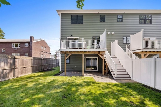125 Ash St Unit 1, Waltham, MA 02453 - rear view of house with a deck, a fenced backyard, stairs, and a patio