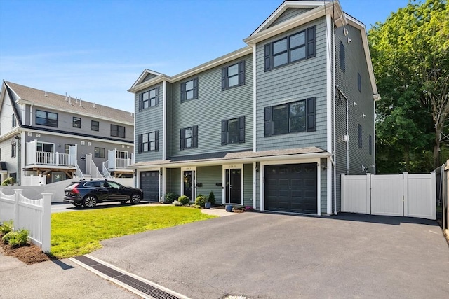 125 Ash St Unit 1, Waltham, MA 02453 - townhome / multi-family property featuring driveway, a gate, and a garage
