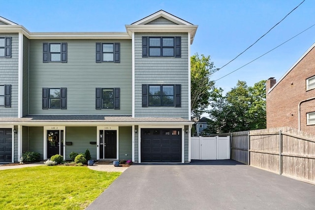 125 Ash St Unit 1, Waltham, MA 02453 - view of property with asphalt driveway and an attached garage