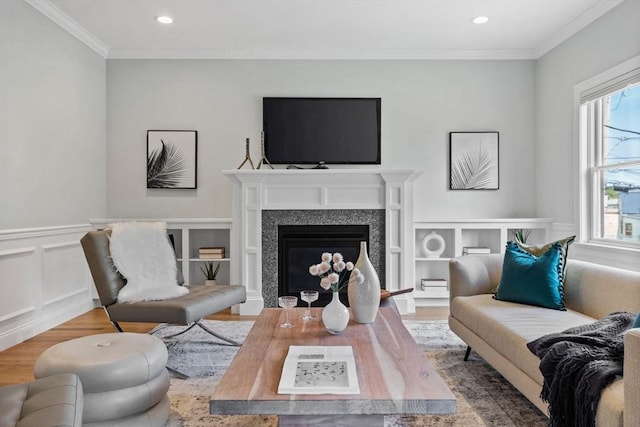 125 Ash St Unit 1, Waltham, MA 02453 - living area featuring wood finished floors, crown molding, a fireplace, and recessed lighting