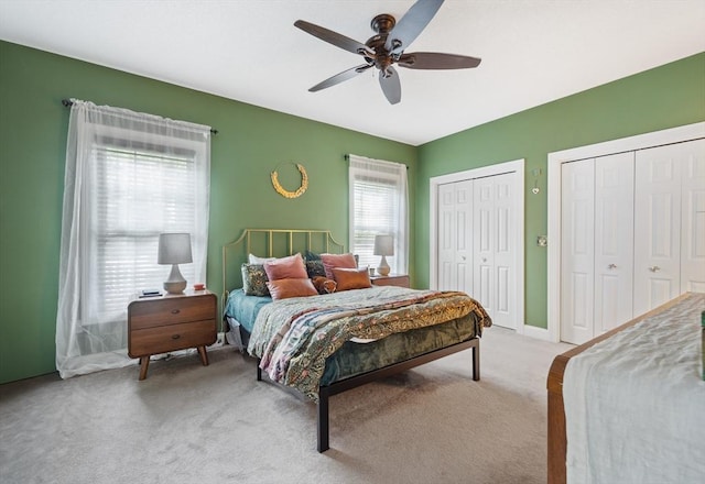 49 Camden St Unit 49, South Hadley, MA 01075 - bedroom featuring light colored carpet, two closets, a ceiling fan, and baseboards