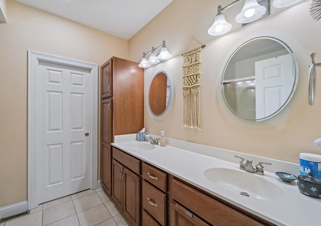 49 Camden St Unit 49, South Hadley, MA 01075 - bathroom with tile patterned flooring, double vanity, baseboards, and a shower