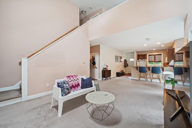 49 Camden St Unit 49, South Hadley, MA 01075 - living room with light carpet, stairs, and baseboards