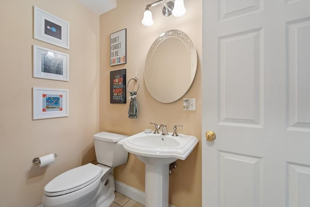 49 Camden St Unit 49, South Hadley, MA 01075 - bathroom featuring toilet, tile patterned floors, and baseboards