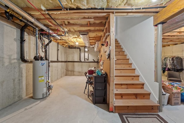 49 Camden St Unit 49, South Hadley, MA 01075 - unfinished basement featuring gas water heater and stairway