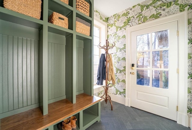 mudroom featuring baseboards and wallpapered walls