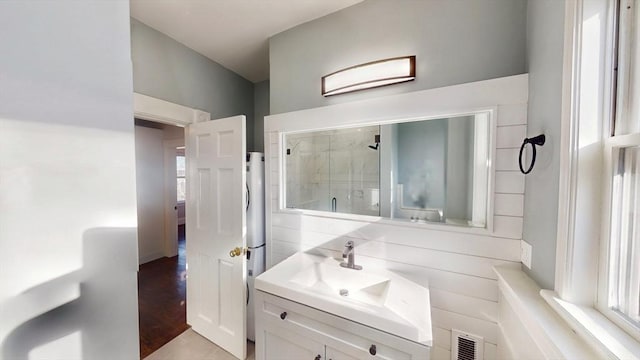 bathroom with vanity and an enclosed shower