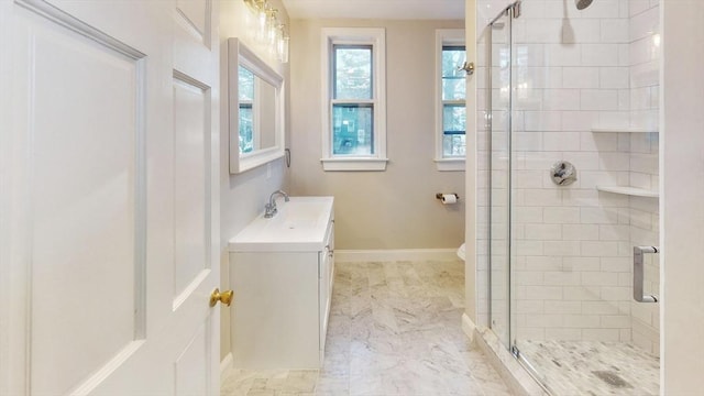 bathroom with a shower with door, vanity, and toilet