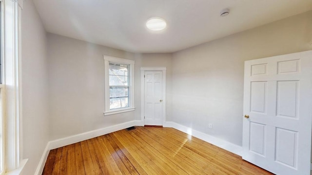 empty room featuring hardwood / wood-style flooring