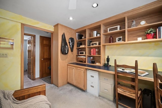 office area featuring recessed lighting, light colored carpet, and built in desk