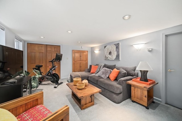 living room featuring light carpet, baseboards, and recessed lighting