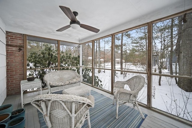 sunroom with a ceiling fan