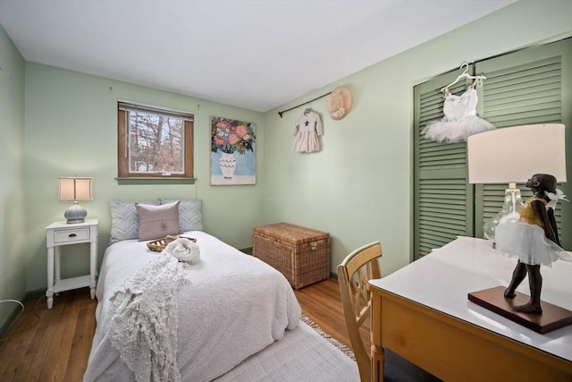 bedroom with wood finished floors