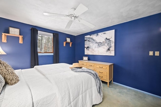 bedroom with baseboards, a ceiling fan, and light colored carpet