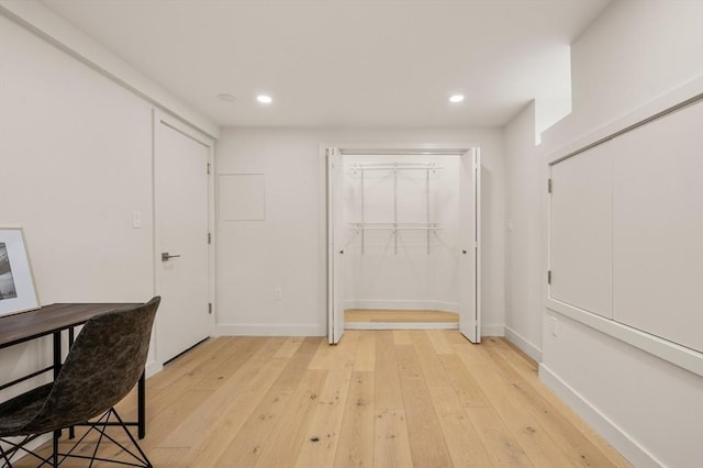 home office with light wood-style floors, baseboards, and recessed lighting