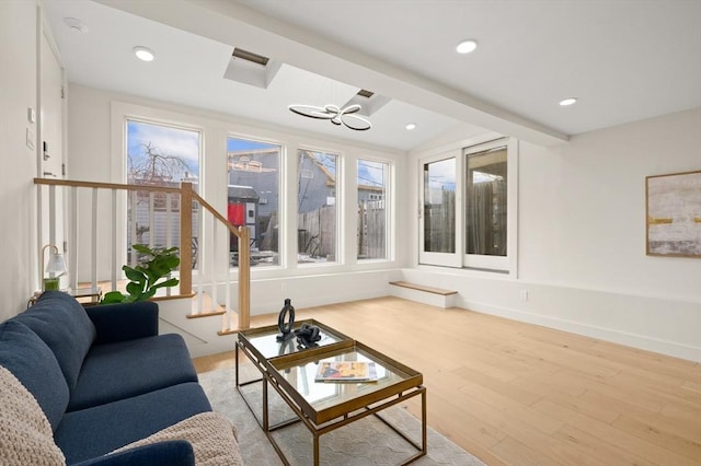 living room featuring stairs, wood finished floors, and recessed lighting