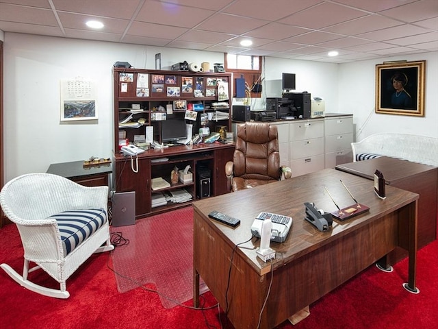 carpeted office space with a paneled ceiling and recessed lighting