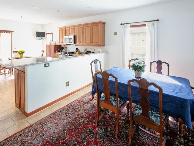 dining area with light tile patterned floors