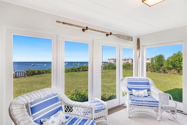 sunroom with a water view