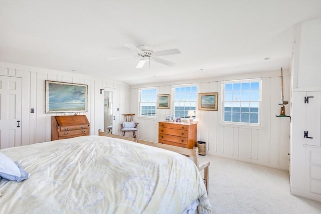 carpeted bedroom with a ceiling fan