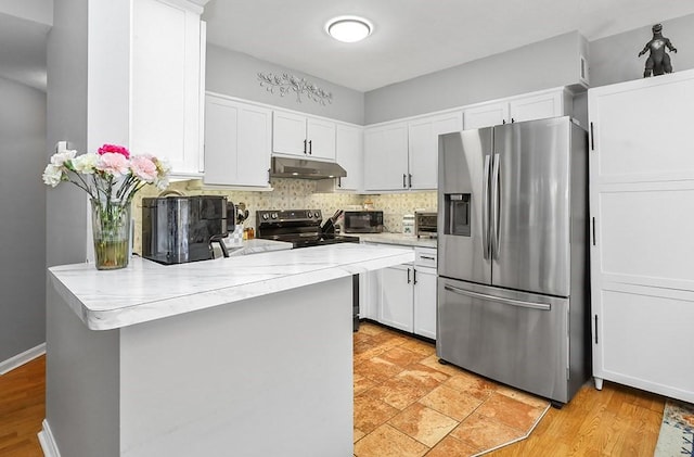 750 Whittenton St Unit 1012, Taunton, MA 02780 - kitchen with appliances with stainless steel finishes, under cabinet range hood, light countertops, a peninsula, and white cabinetry