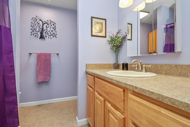 750 Whittenton St Unit 1012, Taunton, MA 02780 - bathroom with vanity, baseboards, and tile patterned flooring