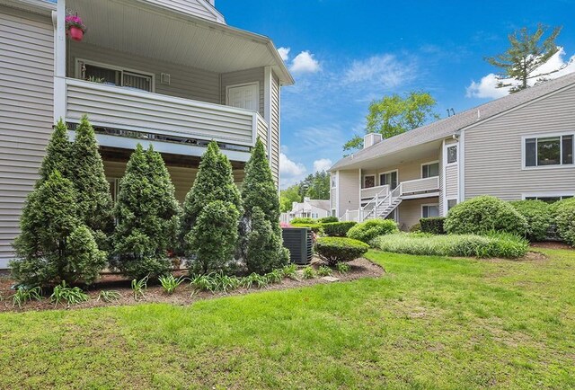 750 Whittenton St Unit 1012, Taunton, MA 02780 - view of grassy yard featuring central AC unit and a balcony