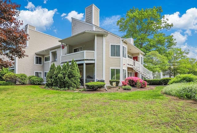 750 Whittenton St Unit 1012, Taunton, MA 02780 - back of property featuring a chimney and a yard