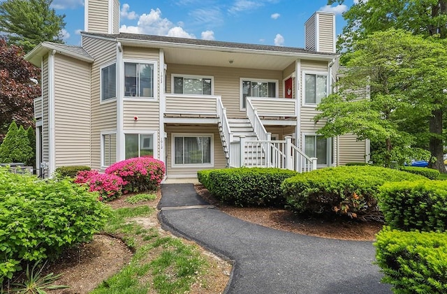 750 Whittenton St Unit 1012, Taunton, MA 02780 - view of front of house featuring a chimney and stairs