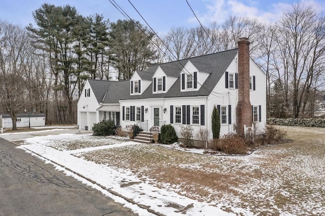 new england style home with a garage