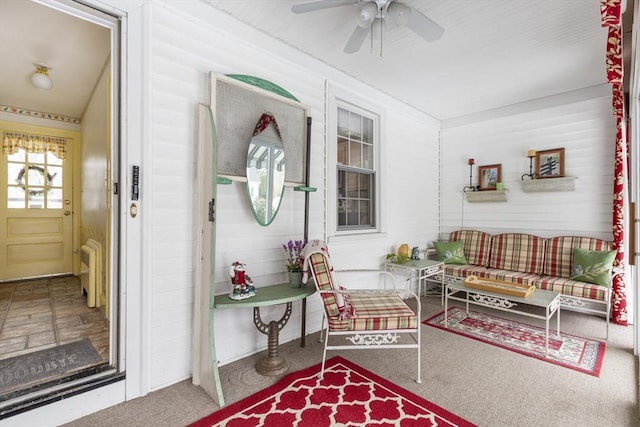 sunroom with ceiling fan