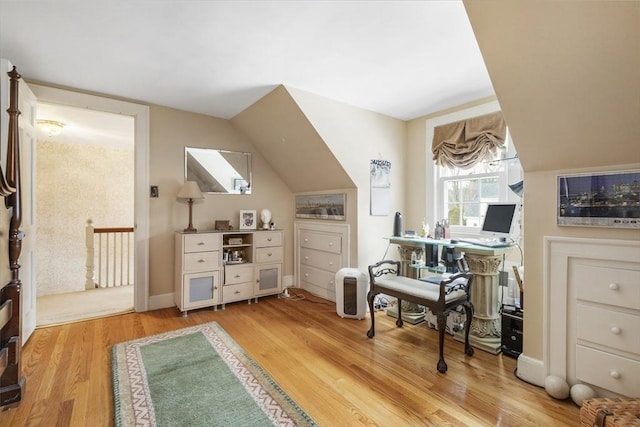 office area with lofted ceiling and light hardwood / wood-style floors