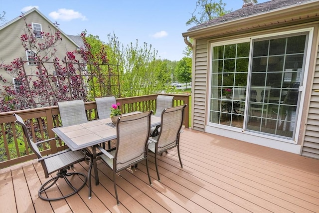 deck with outdoor dining area