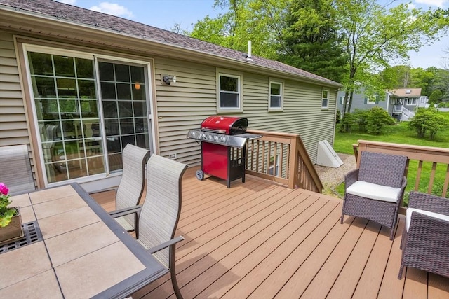 deck featuring a grill