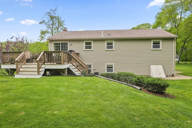 back of house featuring a deck, a lawn, stairway, and a chimney